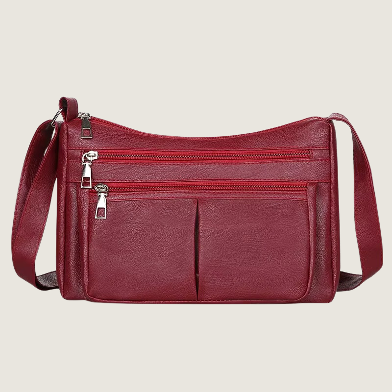 Elegância e praticidade em uma peça só. A Bolsa Carafori Ombro & Crossbody possui couro tecnológico premium, compartimentos com zíper e alça ajustável.
