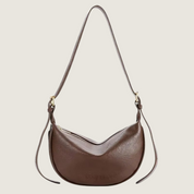Bolsa a tiracolo Carafori em couro sintético premium. Estilo atemporal, versátil e elegante para o dia a dia.