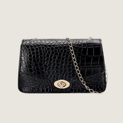 Sofisticação atemporal: bolsa feminina Carafori em couro preto, perfeita para todas as ocasiões.