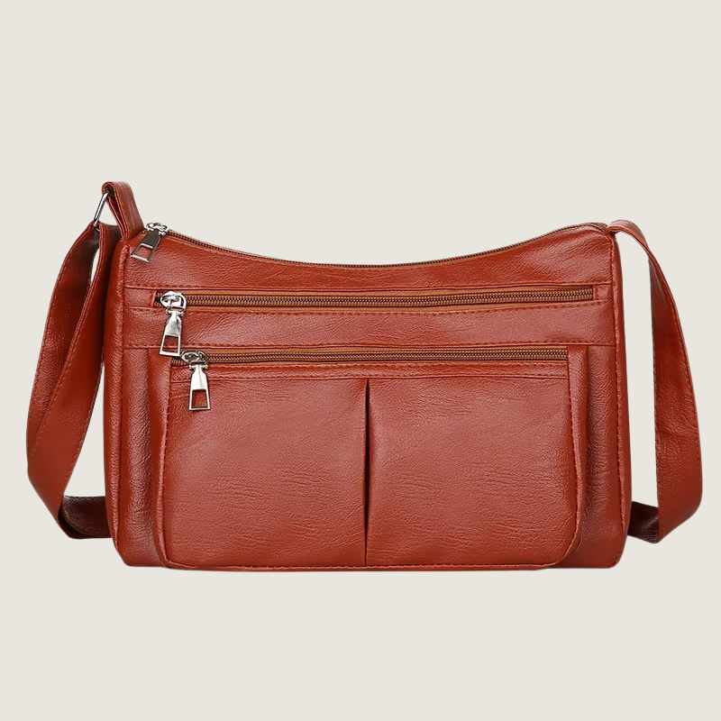 Com textura refinada e ferragens polidas, a Bolsa Carafori Ombro & Crossbody garante elegância atemporal e praticidade. Ideal para rotinas dinâmicas.