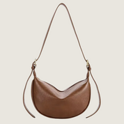 Bolsa hobo Carafori com design sofisticado e alça ajustável. Luxo minimalista e praticidade para todas as ocasiões.