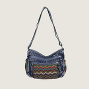 Bolsa bordada étnica com detalhes artesanais, combinando sofisticação e praticidade para mulheres modernas.