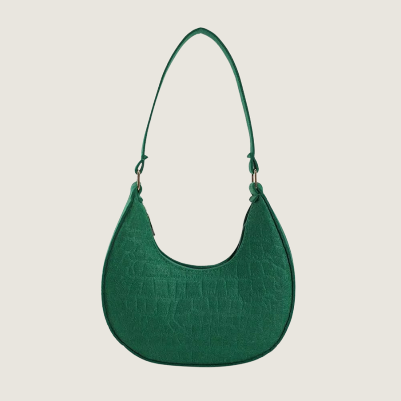 A Bolsa Meia-Lua Carafori em feltro premium une elegância minimalista, leveza e praticidade. Design atemporal para mulheres que valorizam moda refinada no dia a dia.