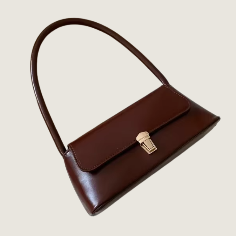 Bolsa de Ombro Carafori Ella marrom, sofisticada e compacta, com fecho metálico refinado e acabamento artesanal premium.