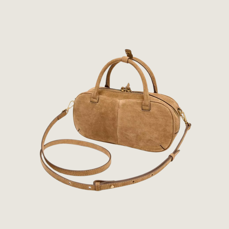 Bolsa feminina Carafori em camurça de luxo acessível, com alça crossbody removível e design exclusivo.